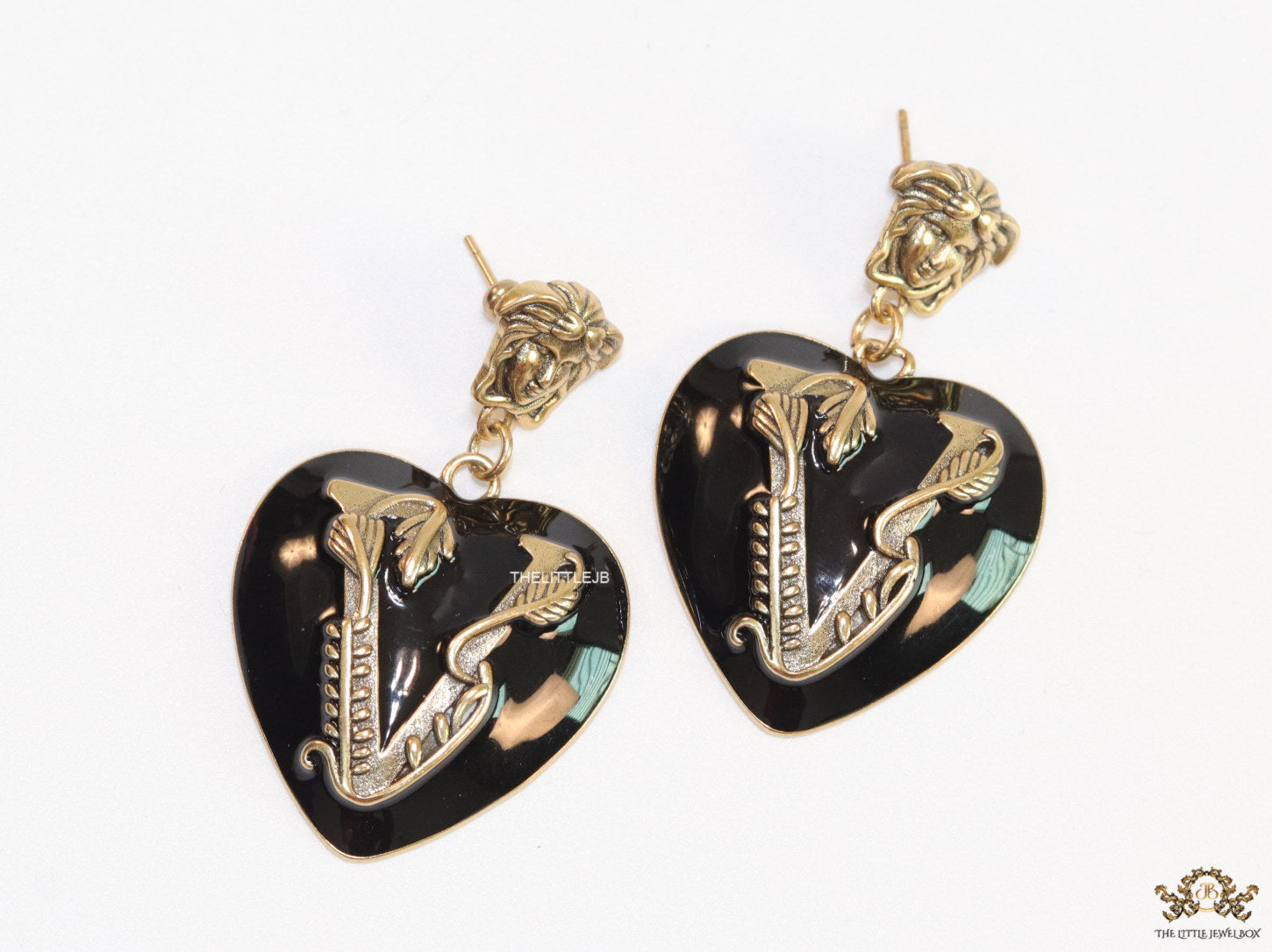 Gold plated medusa earrings with V motif black heart shape drop
