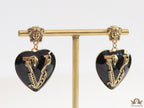 Gold plated medusa earrings with V motif black heart shape drop