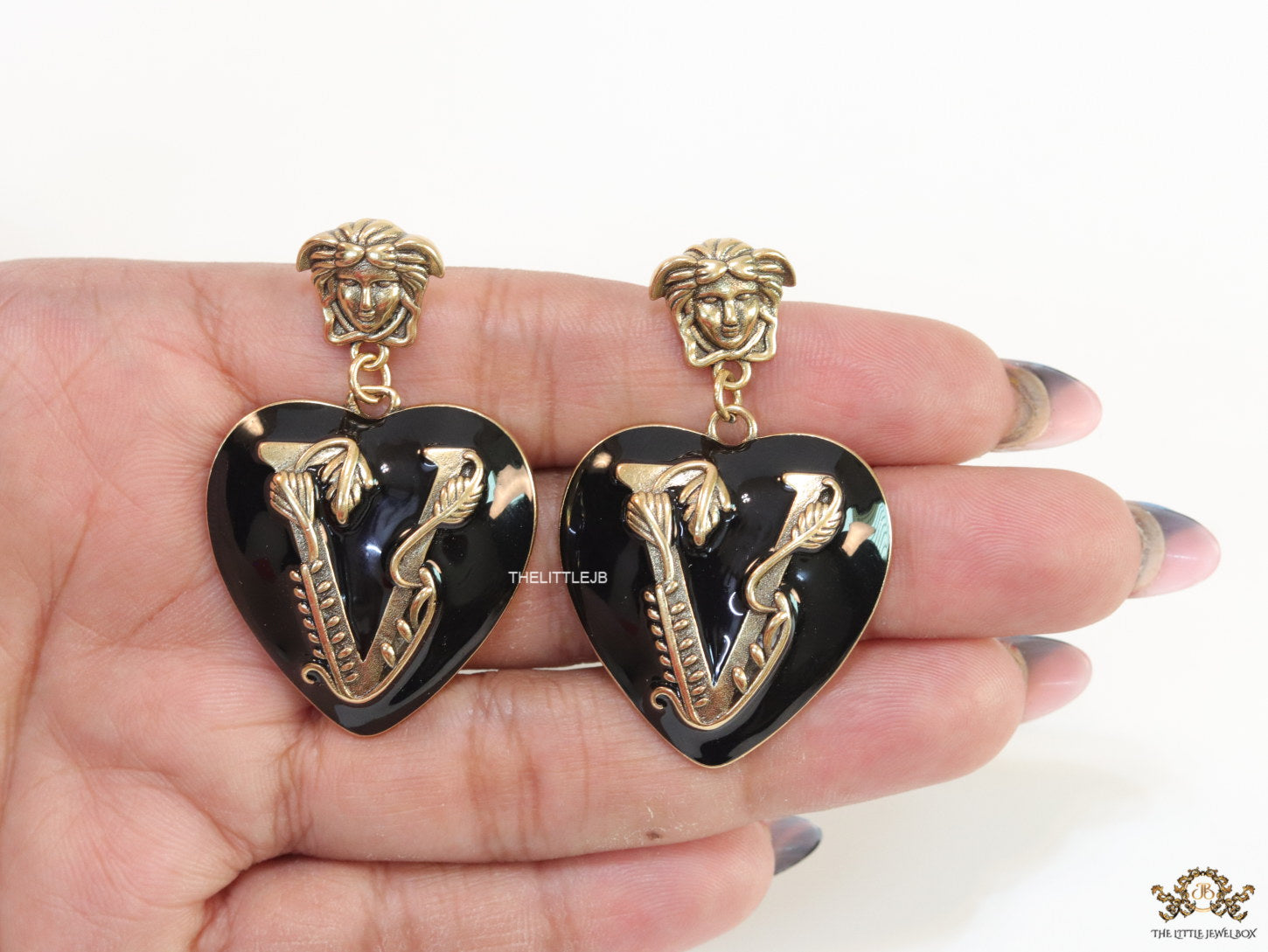 Gold plated medusa earrings with V motif black heart shape drop
