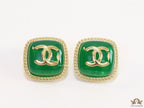 Green twin C motif stud earrings in golden finish