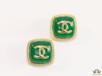 Green twin C motif stud earrings in golden finish