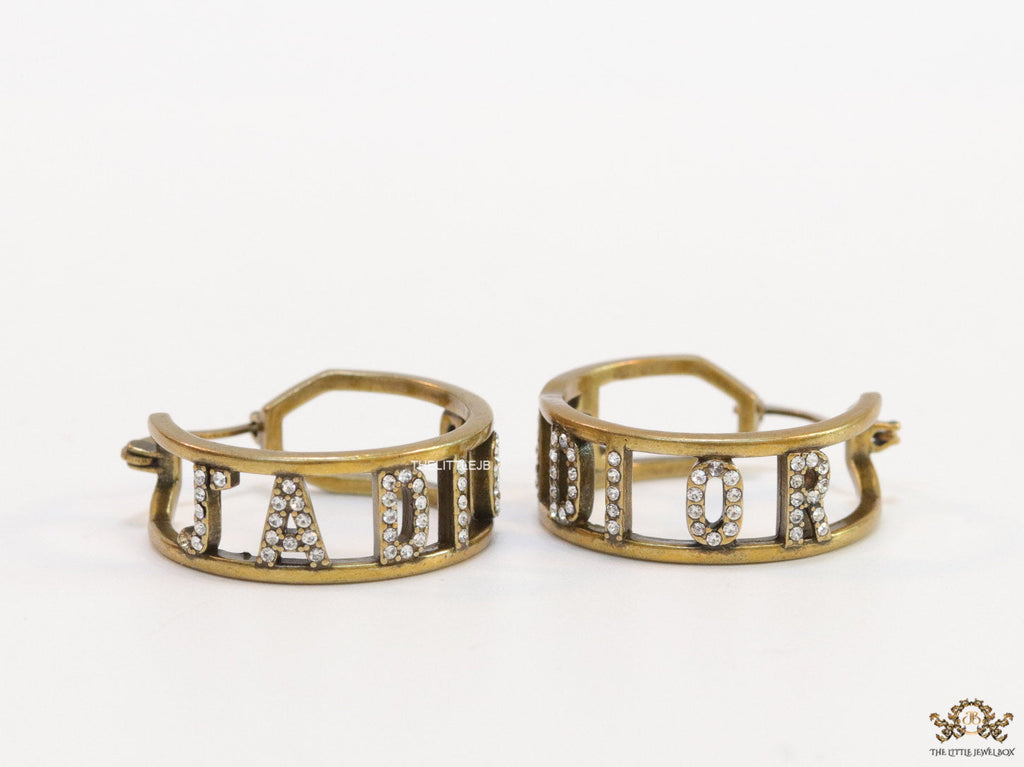 Broad golden hoops with cz alphabets
