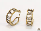 Broad golden hoops with cz alphabets