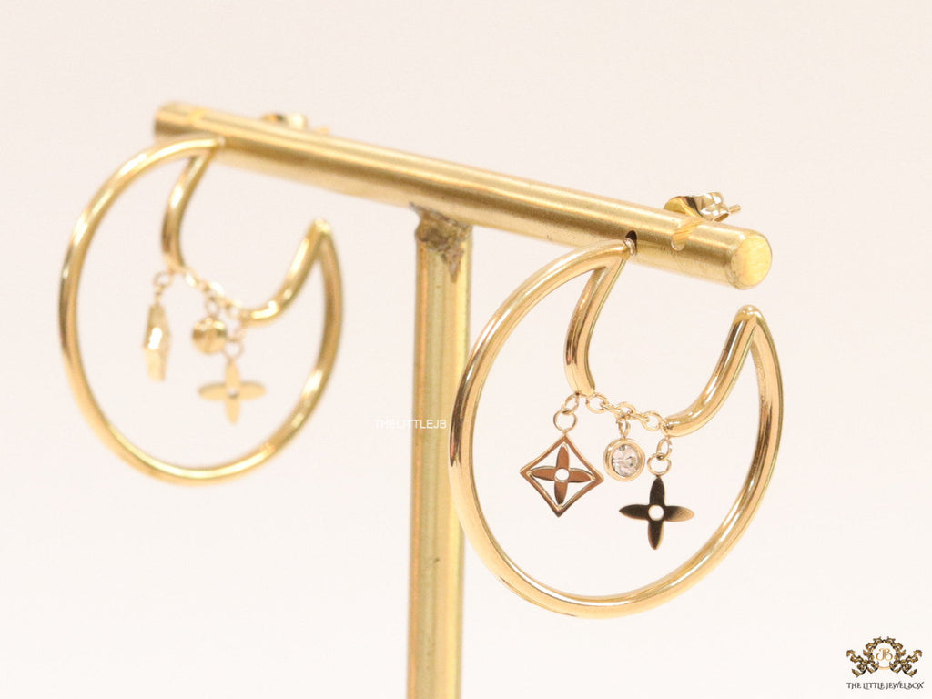 Designer golden hoops with various charms