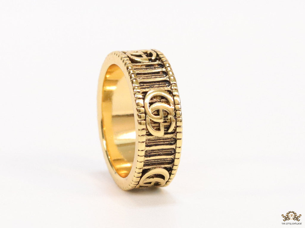 Double G ring band in antique gold finish
