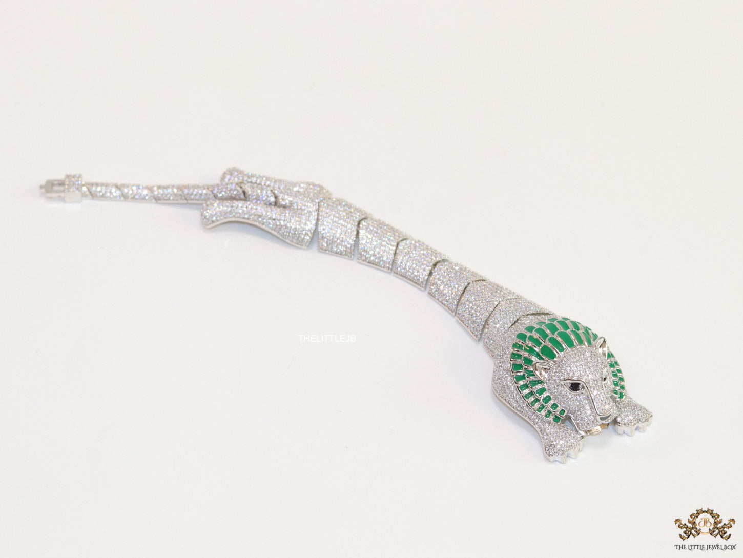 Platinum plated unique panther bracelet with cz and emerald green stones