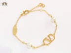 Alphabet V bracelet with sleek chain and pearls