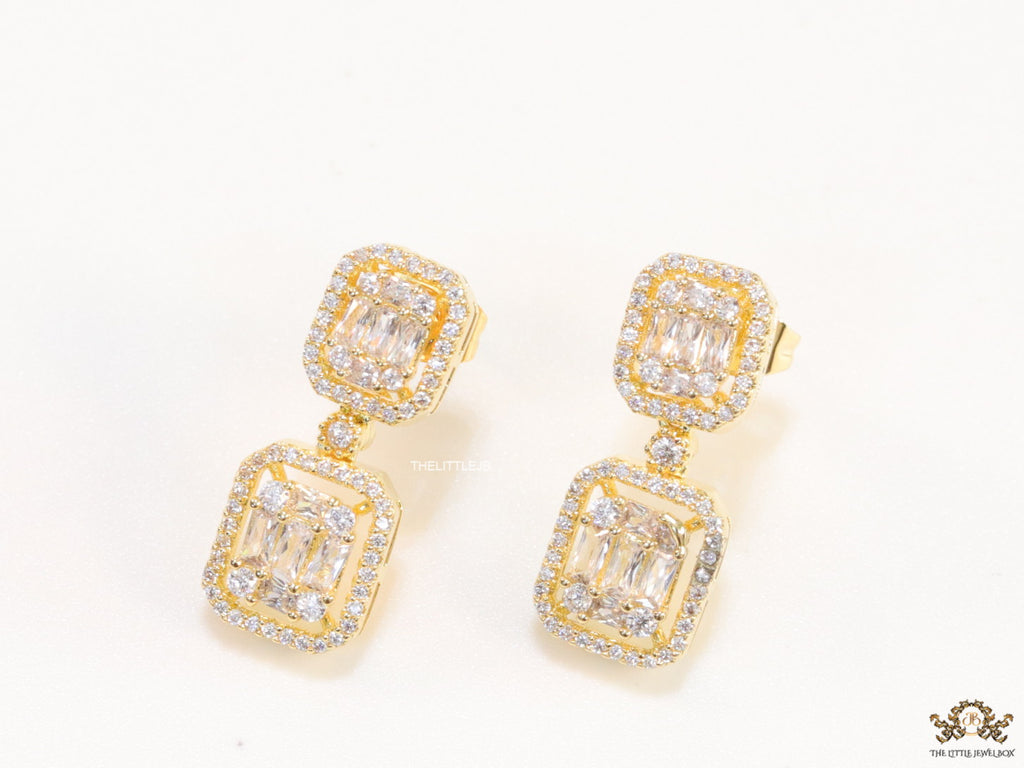 Gold plated cz dangle earrings with cz baguettes