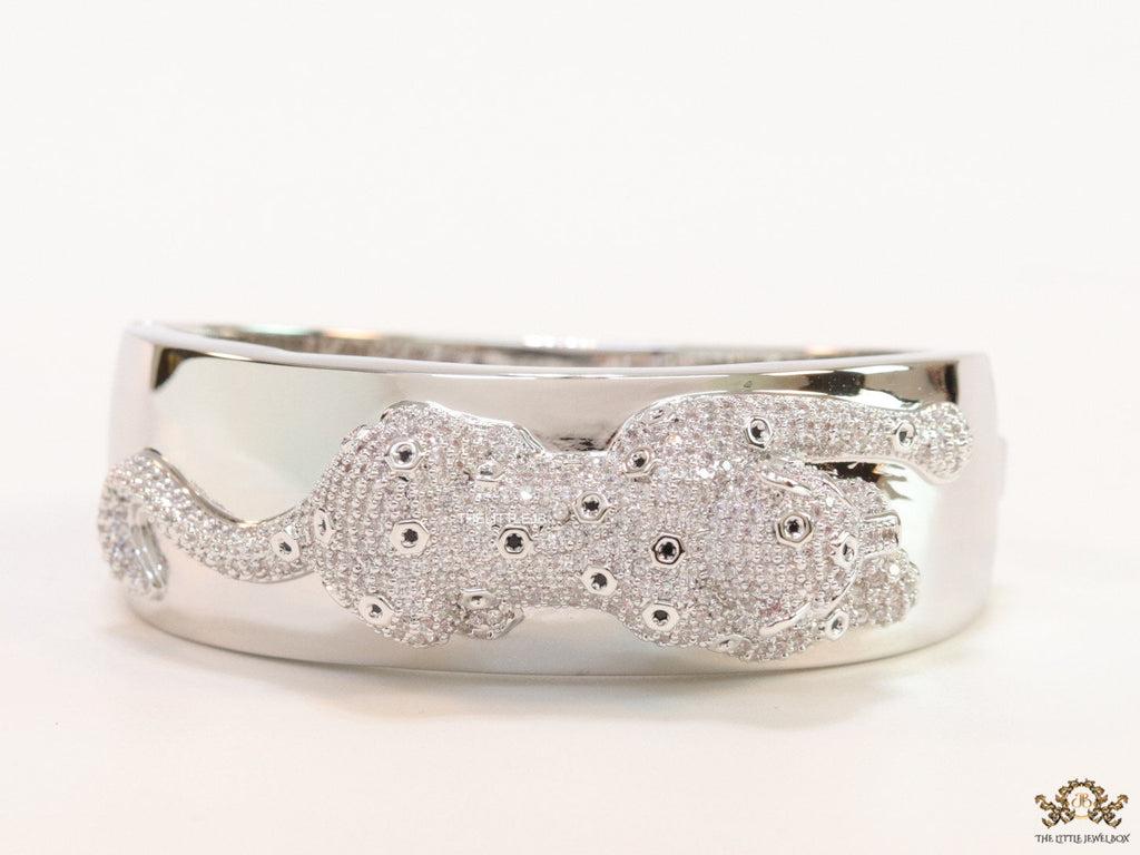Broad band platinum bracelet with cz panther motif
