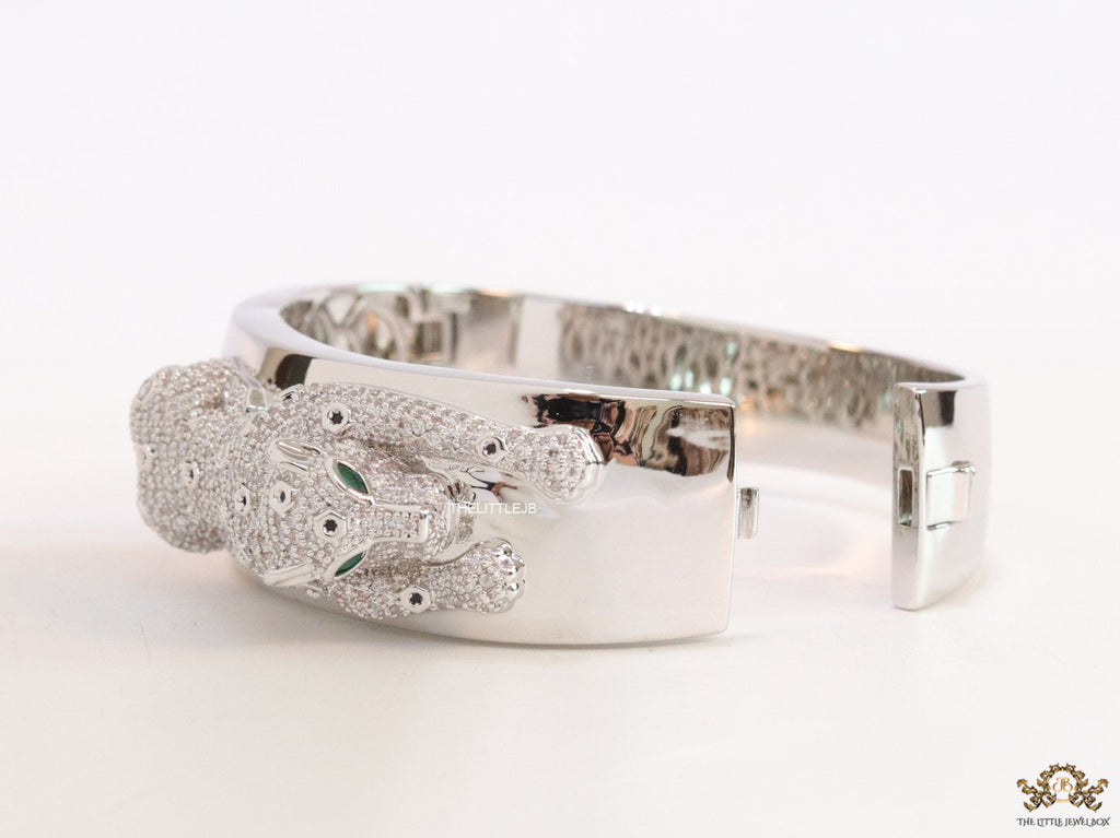 Broad band platinum bracelet with cz panther motif