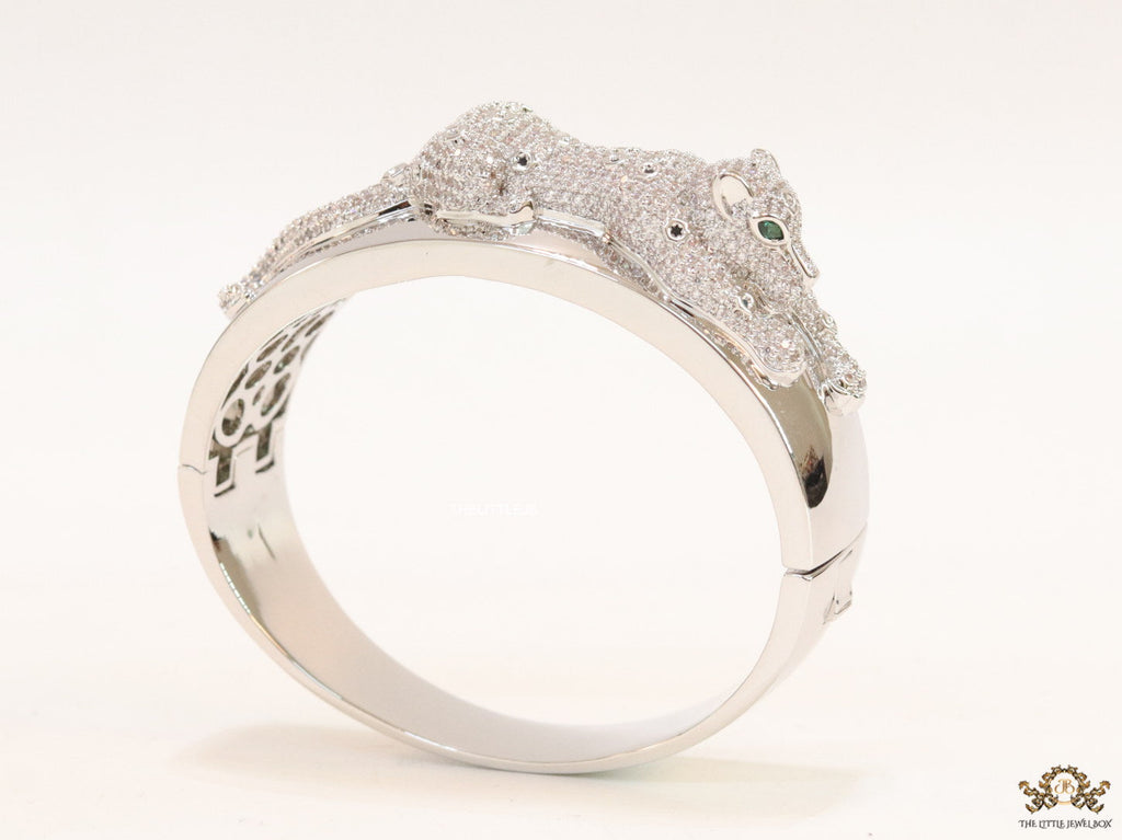 Broad band platinum bracelet with cz panther motif