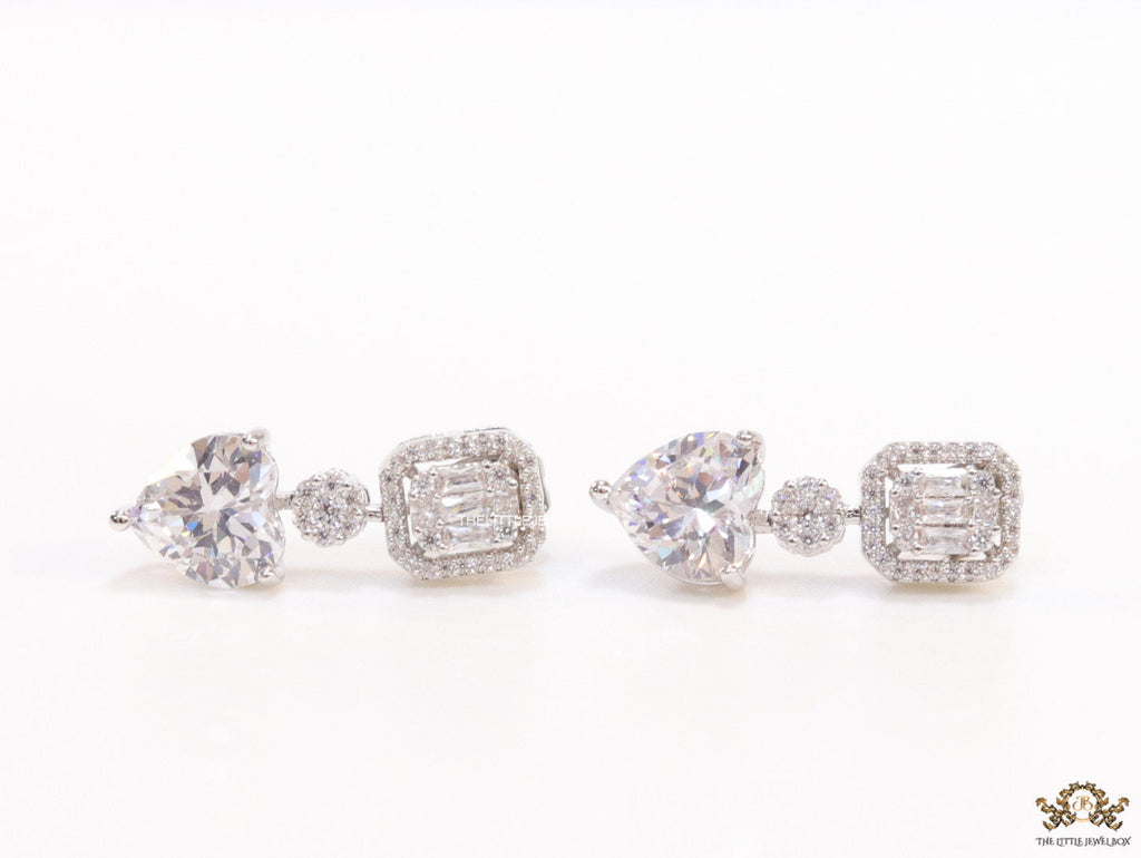 Cz baguette earrings in platinum with heart shape cz drop