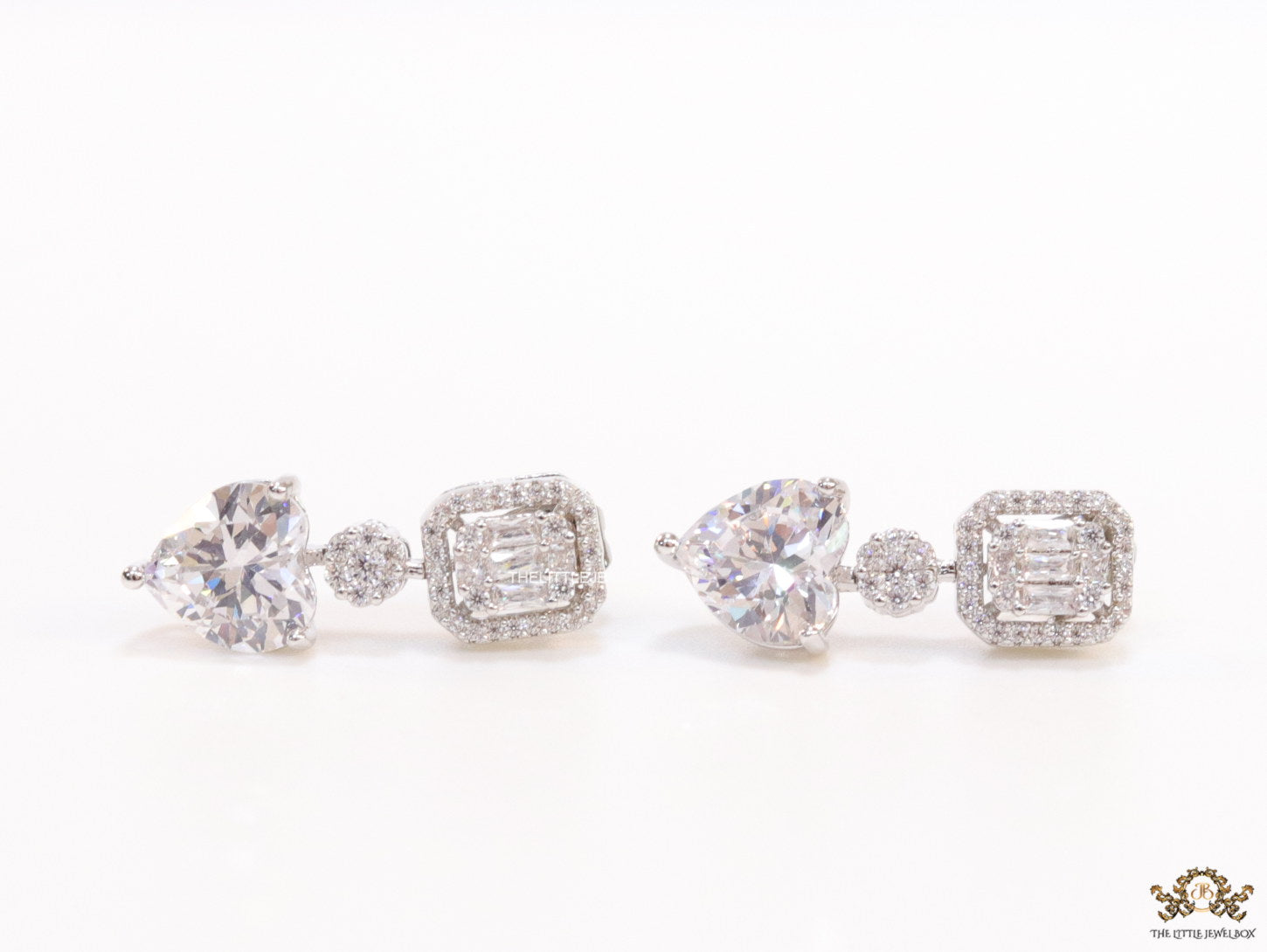 Cz baguette earrings in platinum with heart shape cz drop