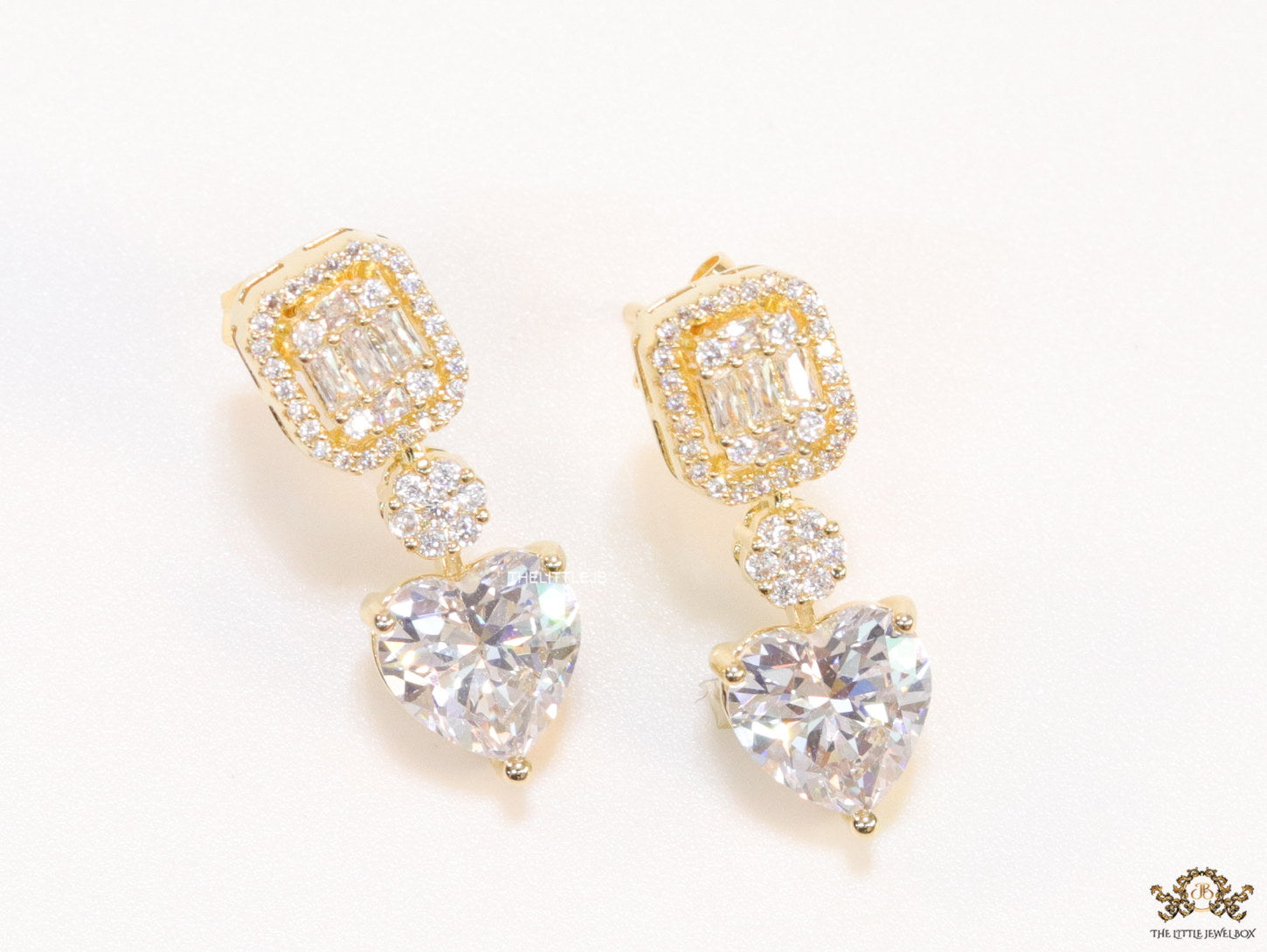 Golden cz baguette earrings with heart shape cz drop