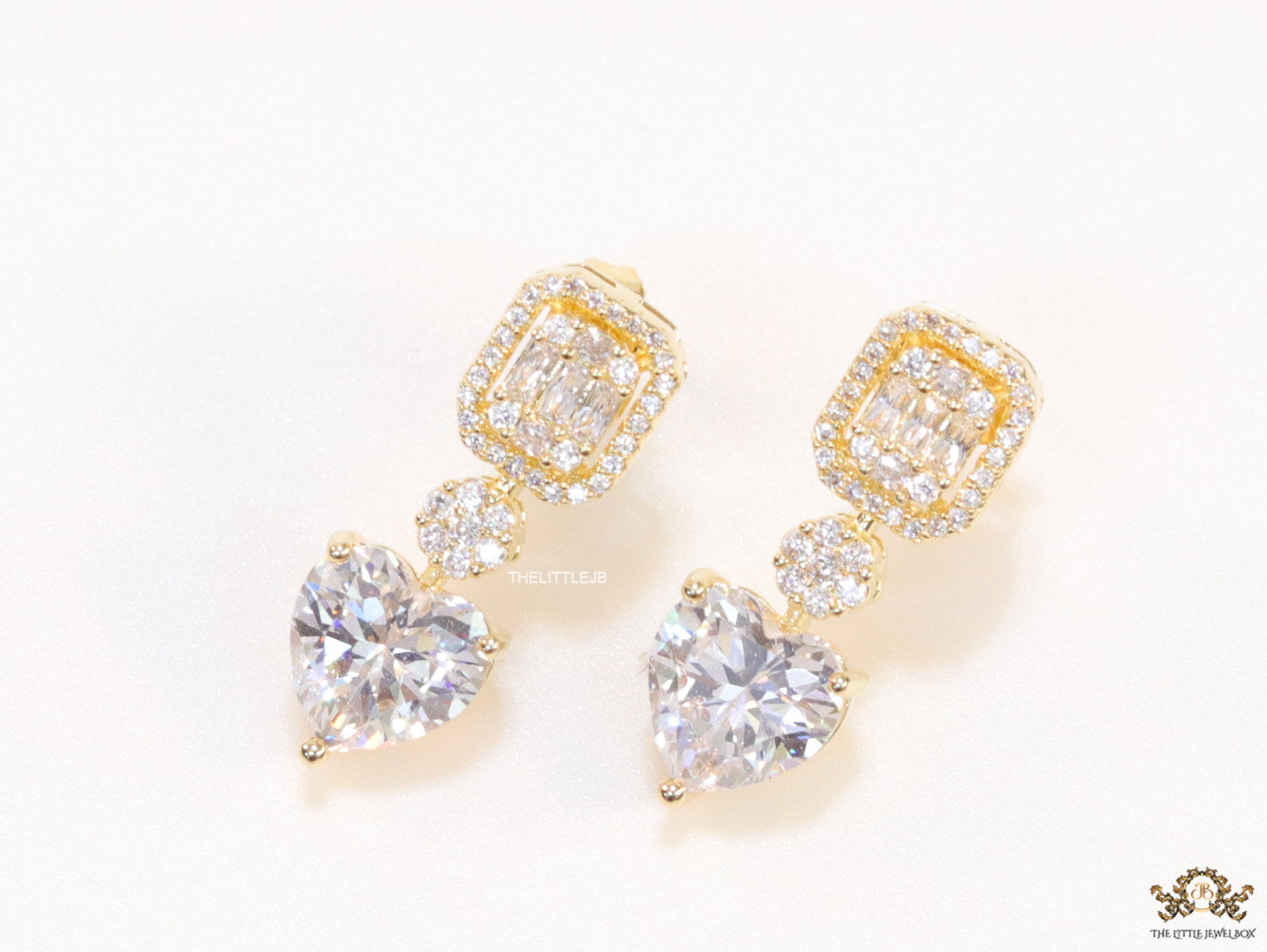 Golden cz baguette earrings with heart shape cz drop