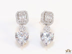 Cz baguette earrings in platinum with heart shape cz drop