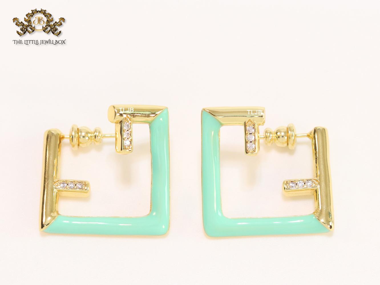 Double F & cyan enamel studs