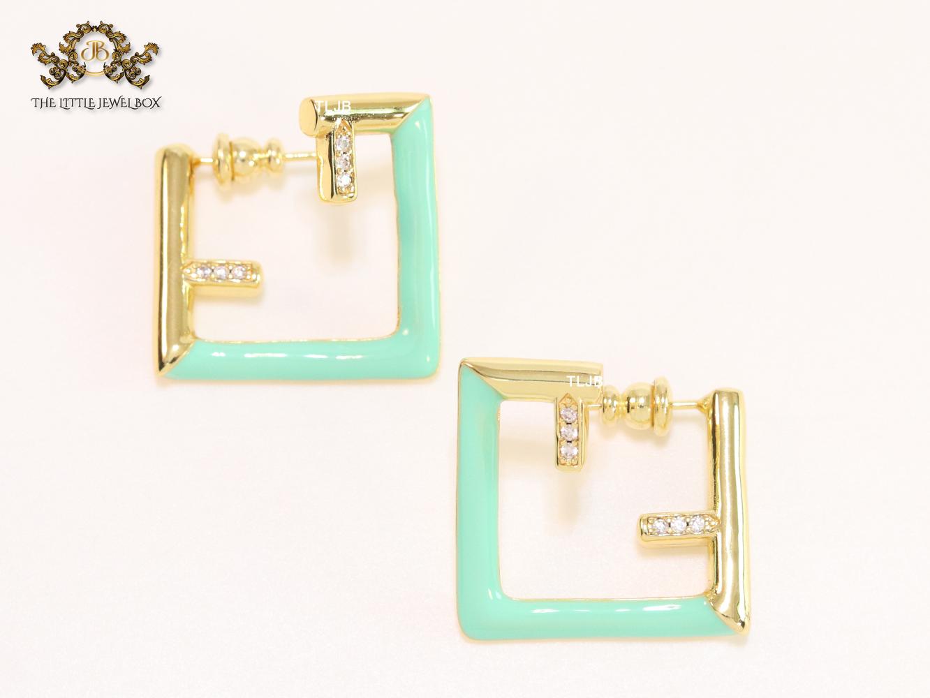 Double F & cyan enamel studs