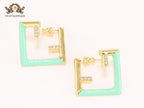 Double F & cyan enamel studs