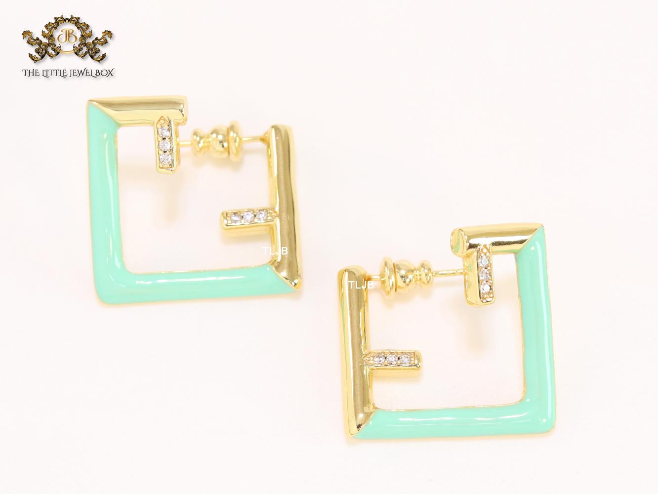 Double F & cyan enamel studs