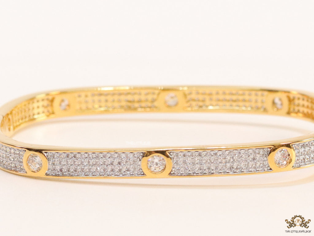 Gold plated openable bracelet studded with cz