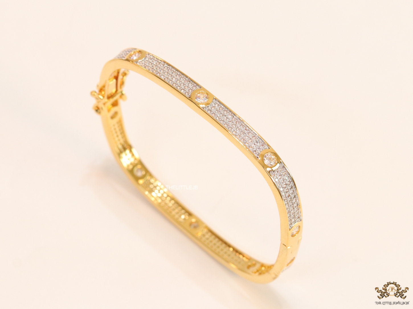 Gold plated openable bracelet studded with cz