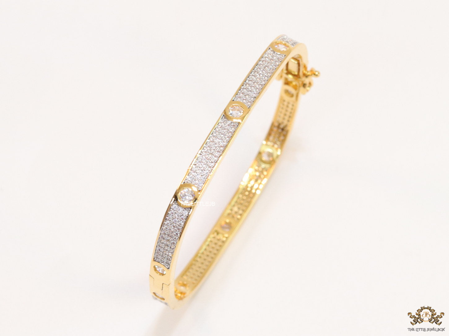 Gold plated openable bracelet studded with cz