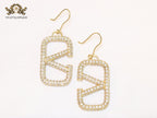 Alphabet open V cz and gold danglers