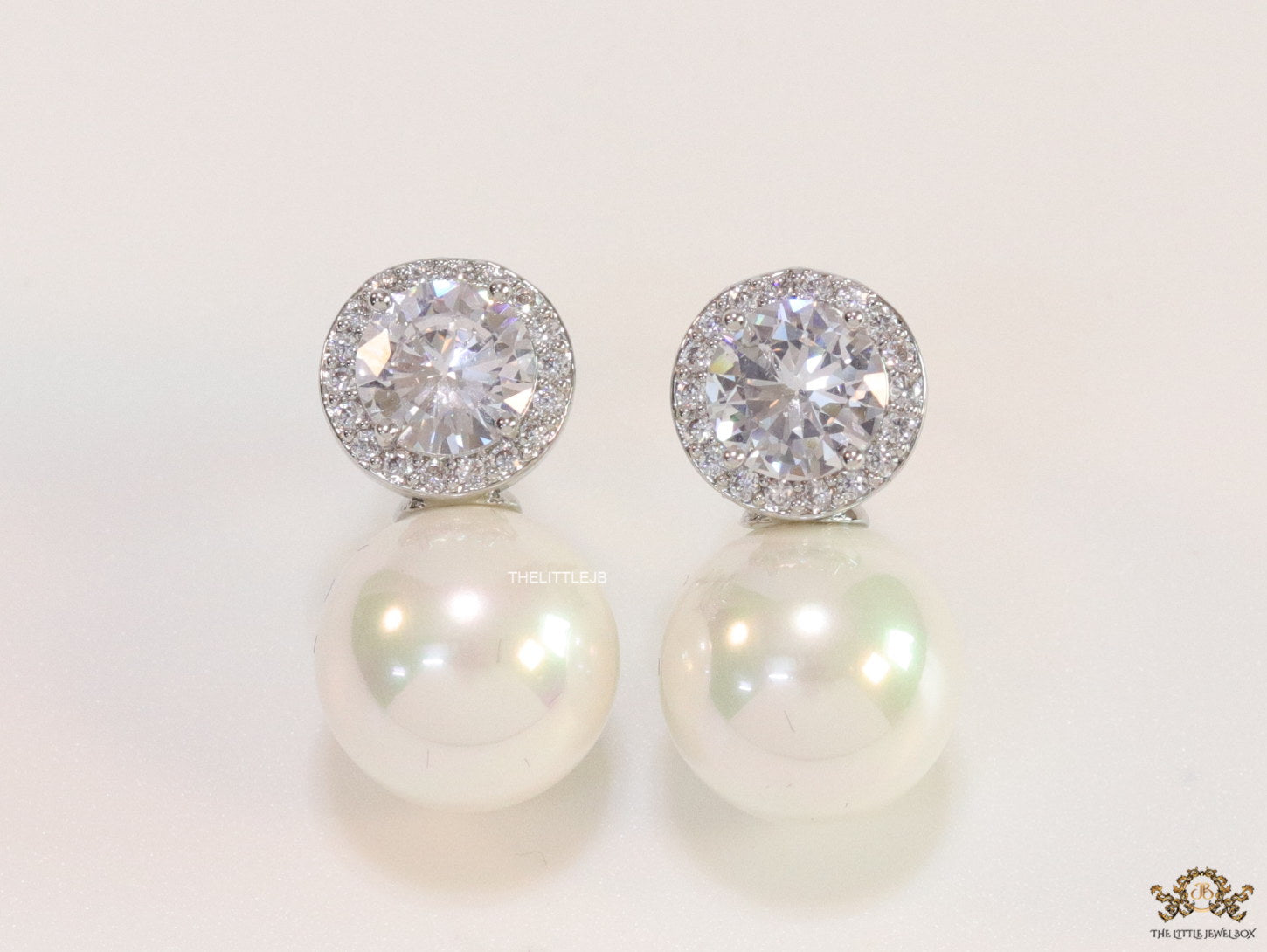 Platinum plated round cz earrings with pearl drop