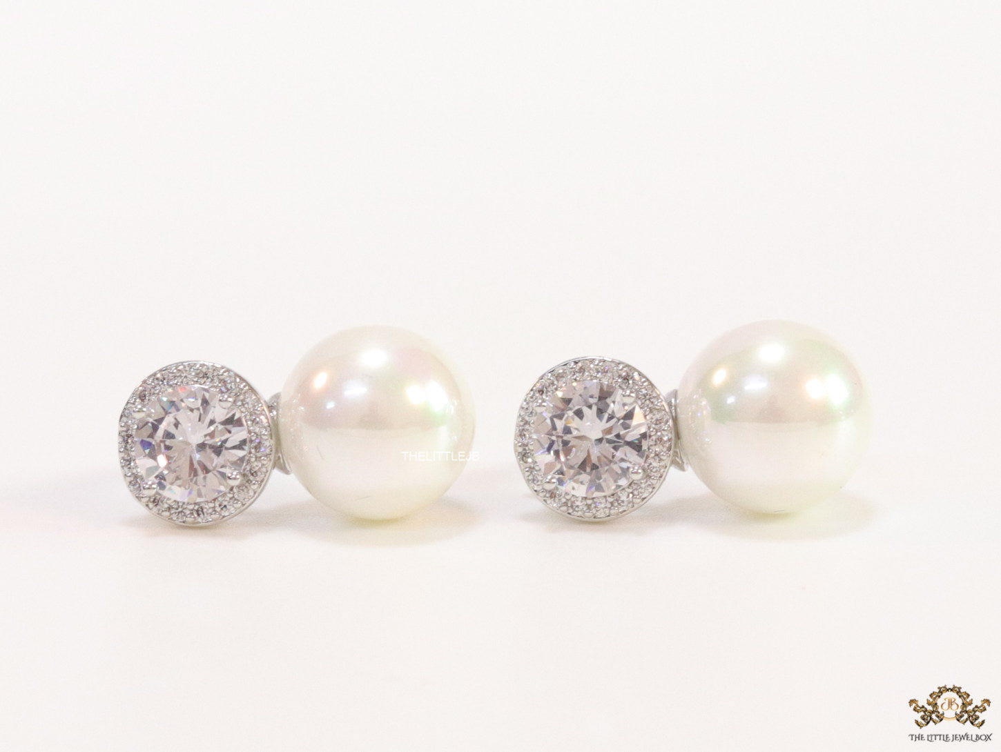 Platinum plated round cz earrings with pearl drop