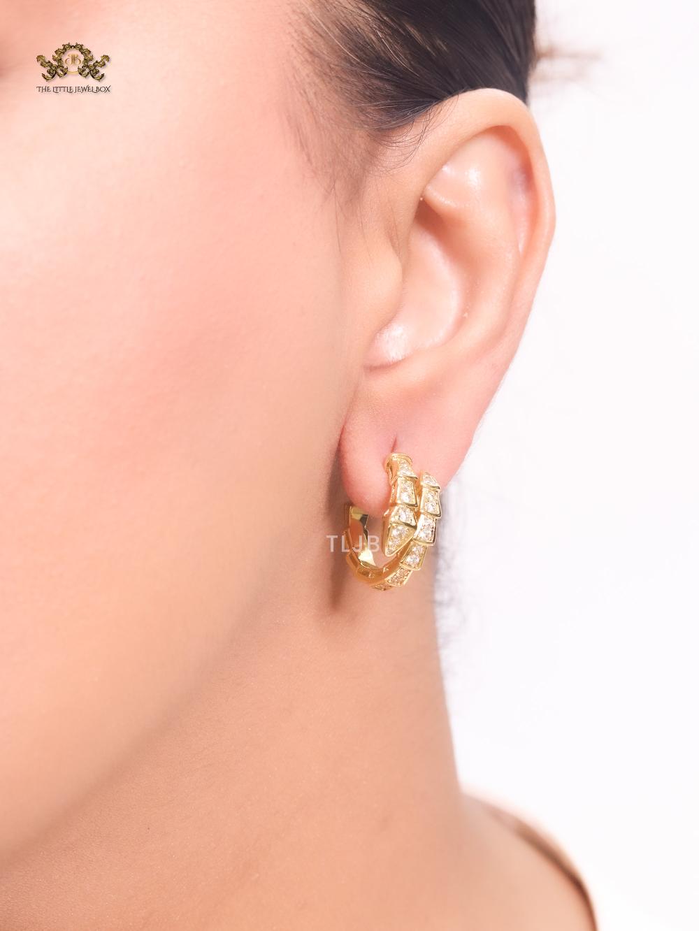 Gold serpentine hoops