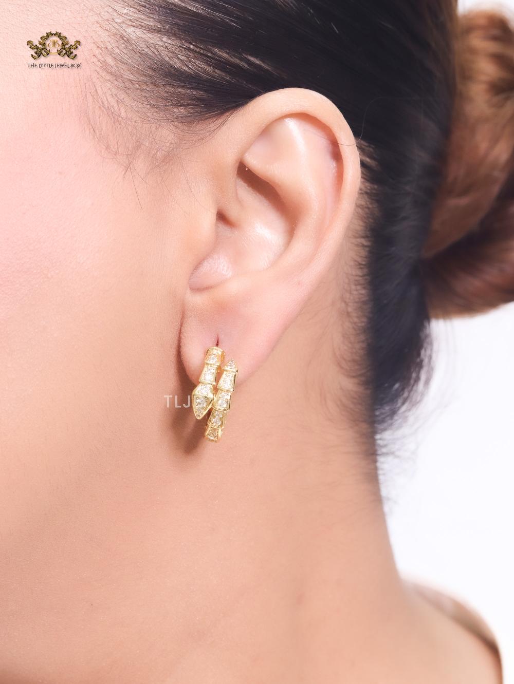 Gold serpentine hoops