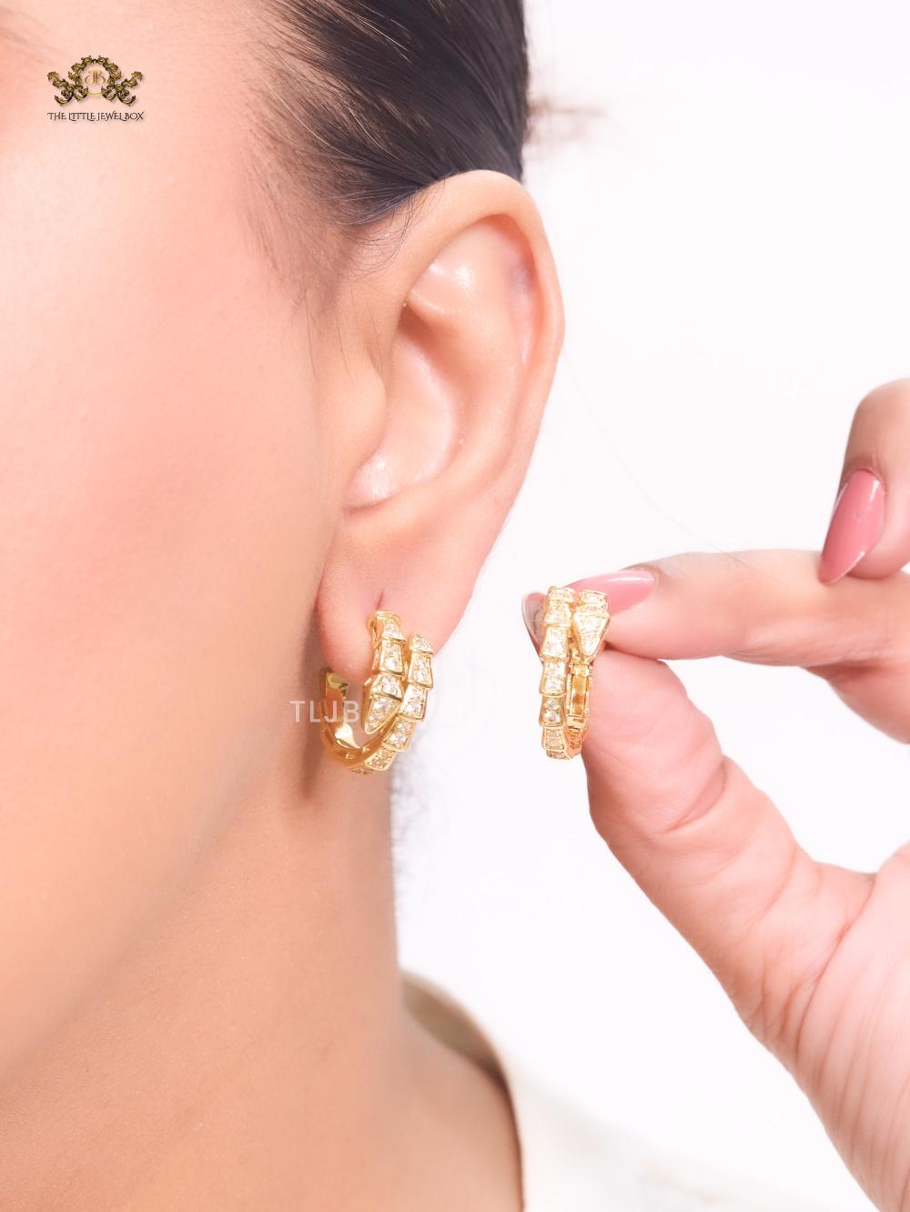 Gold serpentine hoops