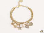 Multilayered gold plated chain bracelet with various cz charms