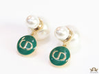 Golden pearl bomber earrings with green alphabet drop