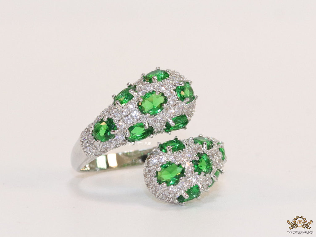 Top open platinum plated white and green cz ring