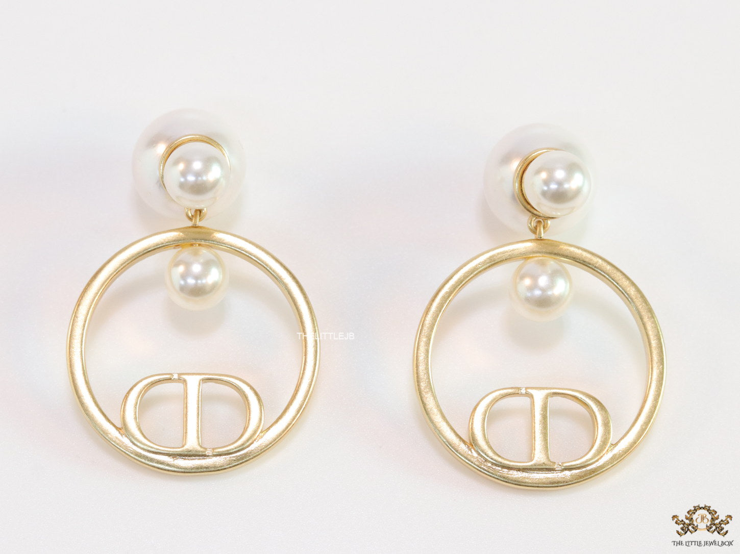 Pearl bomber earrings with golden alphabet ring drop