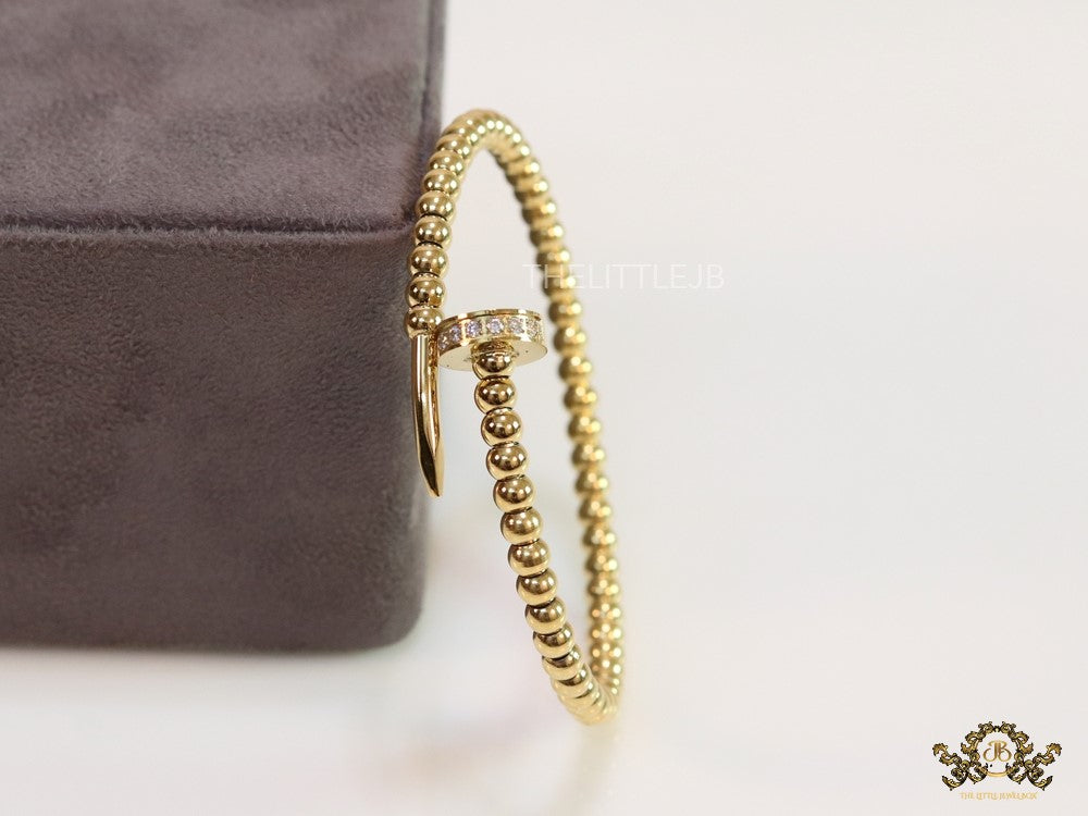 Gold plated openable nail bracelet with cz and metallic beads