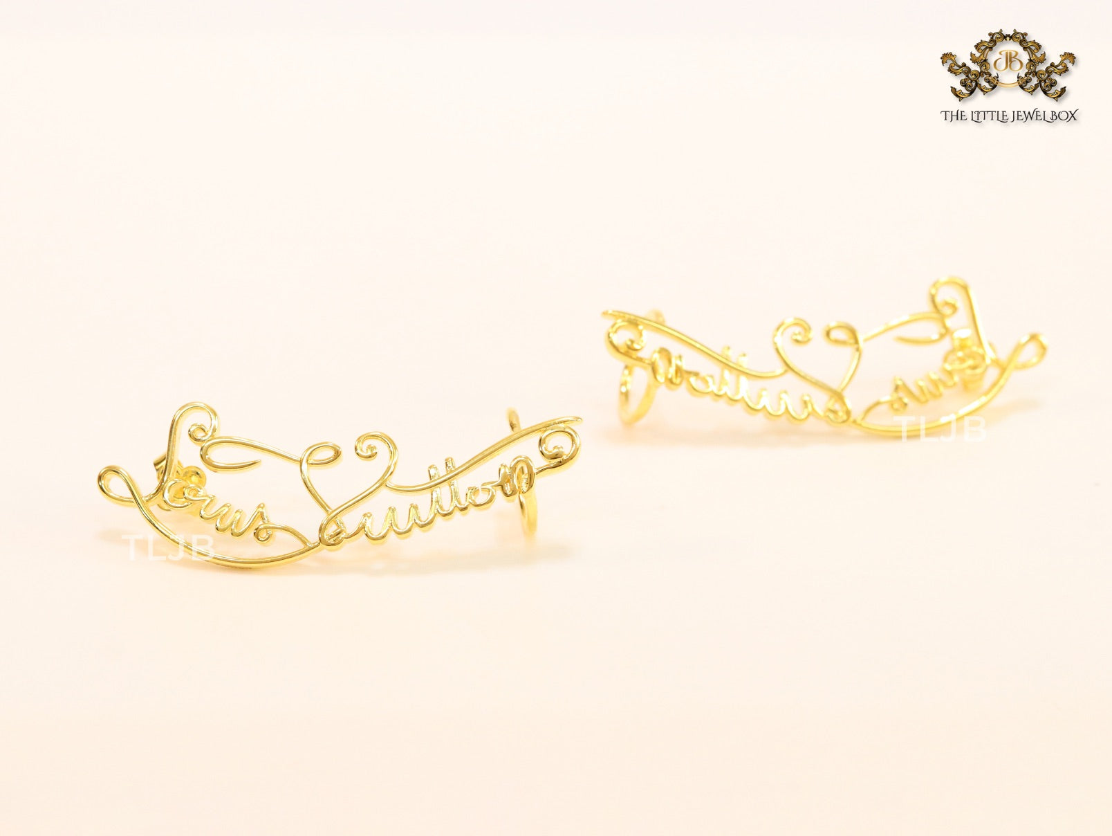 Alphabet L and V ear-cuffs in gold