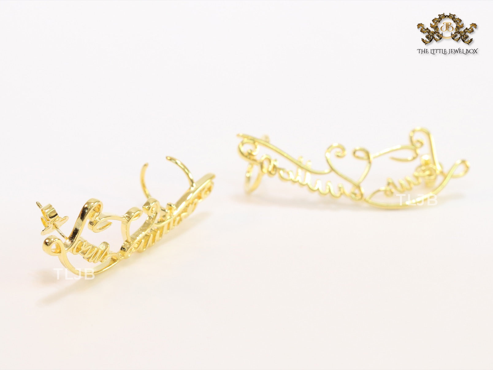 Alphabet L and V ear-cuffs in gold