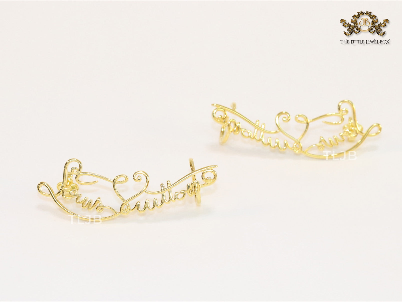 Alphabet L and V ear-cuffs in gold