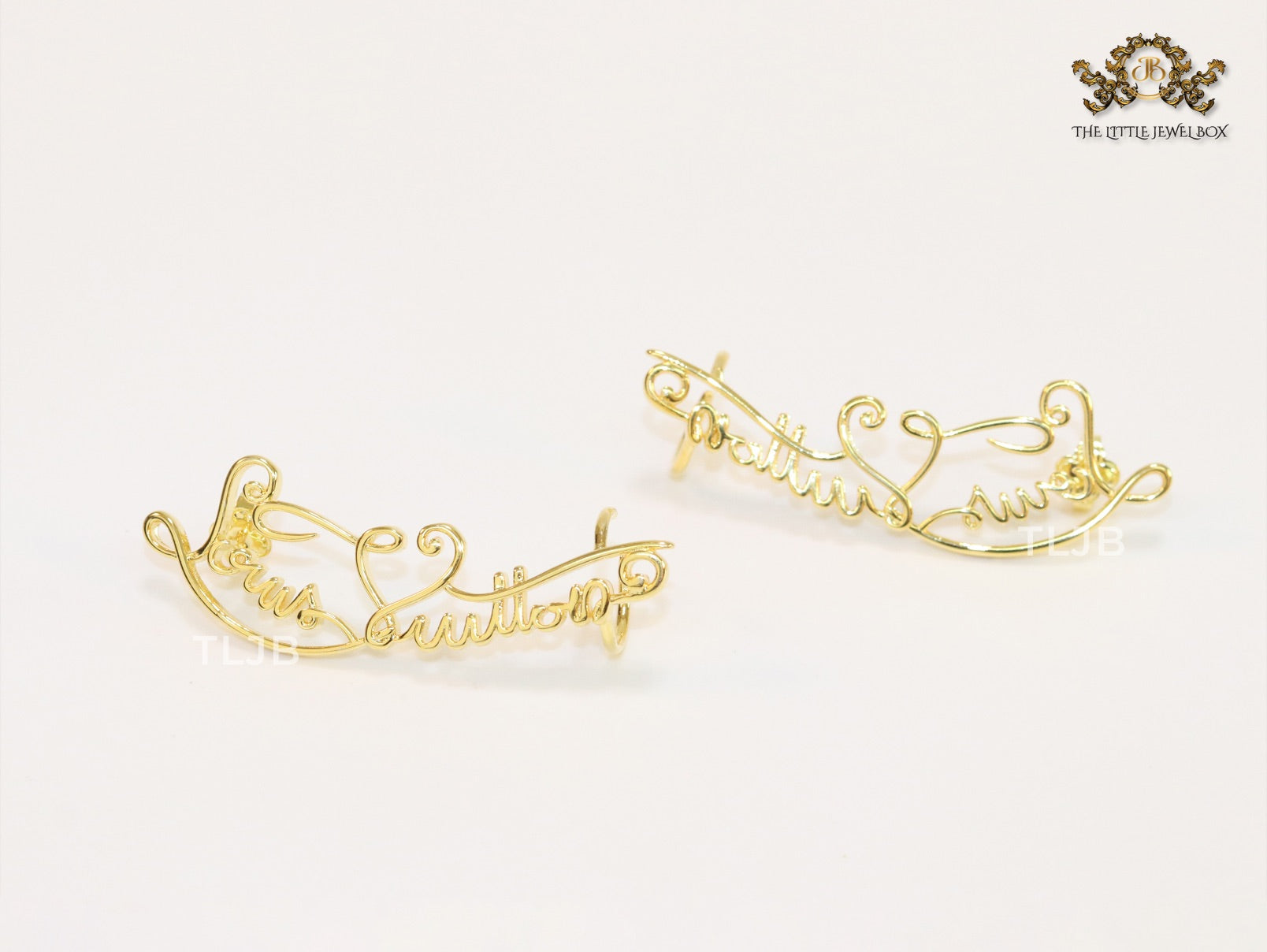 Alphabet L and V ear-cuffs in gold