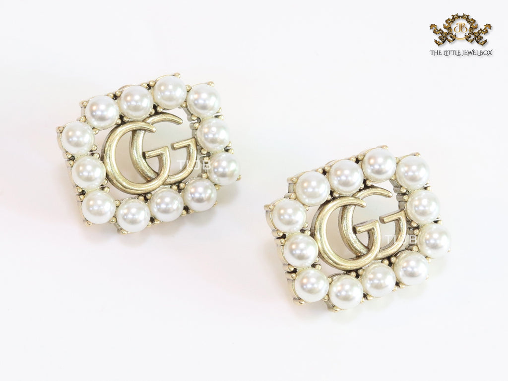Double G rustic pearl studs