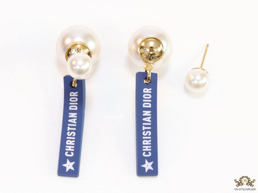 Blue silicon lapel drops with branding on pearl bomber studs