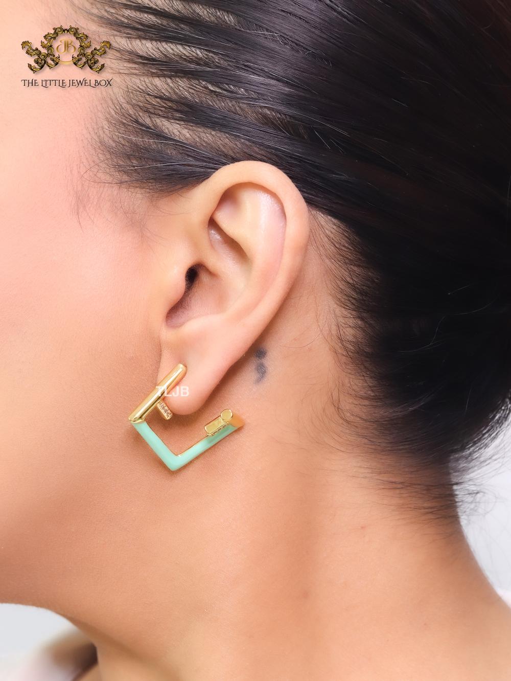 Double F & cyan enamel studs