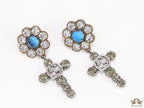 Floral cz and alphabet dangles with blue stone centre