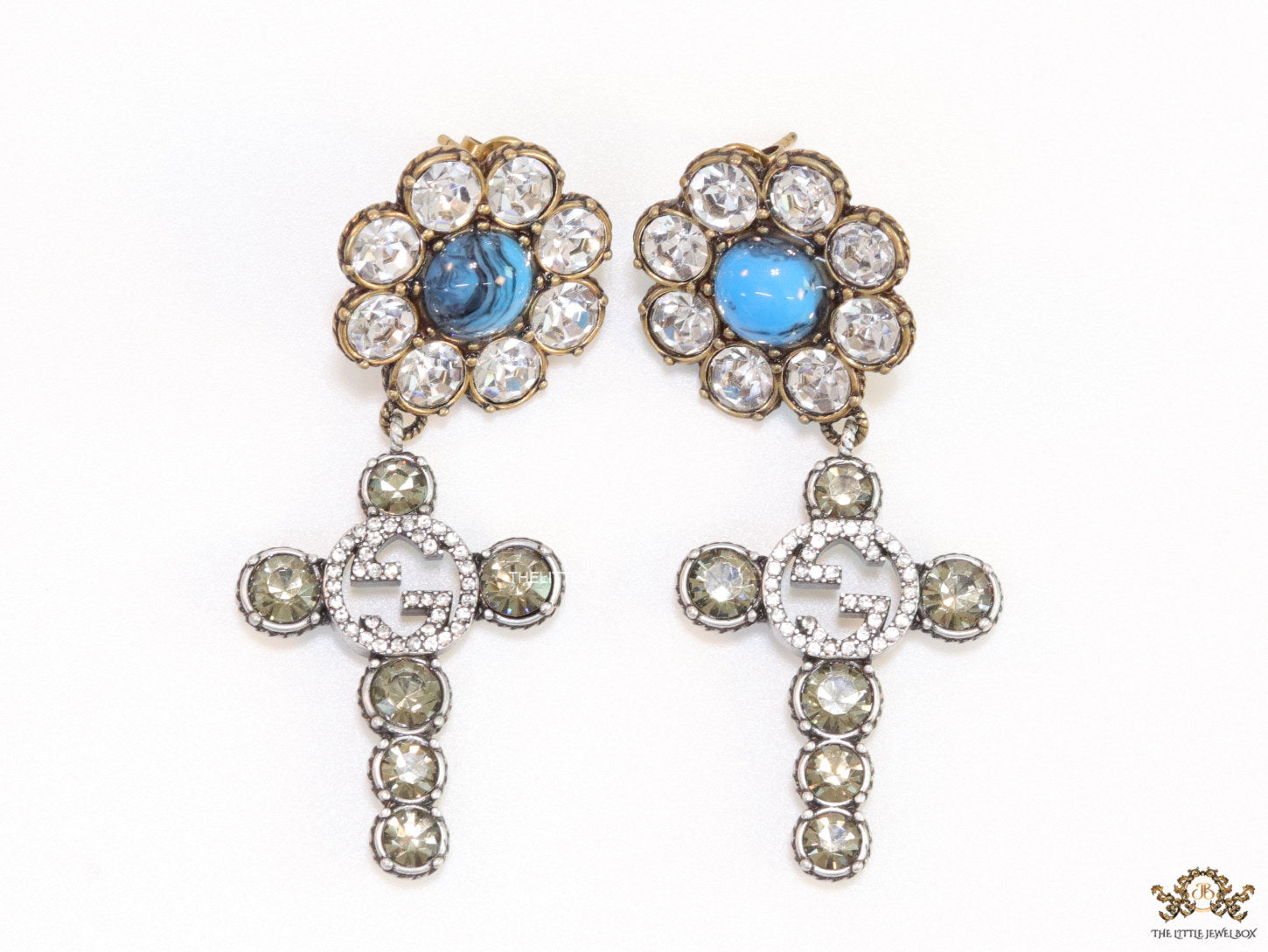 Floral cz and alphabet dangles with blue stone centre
