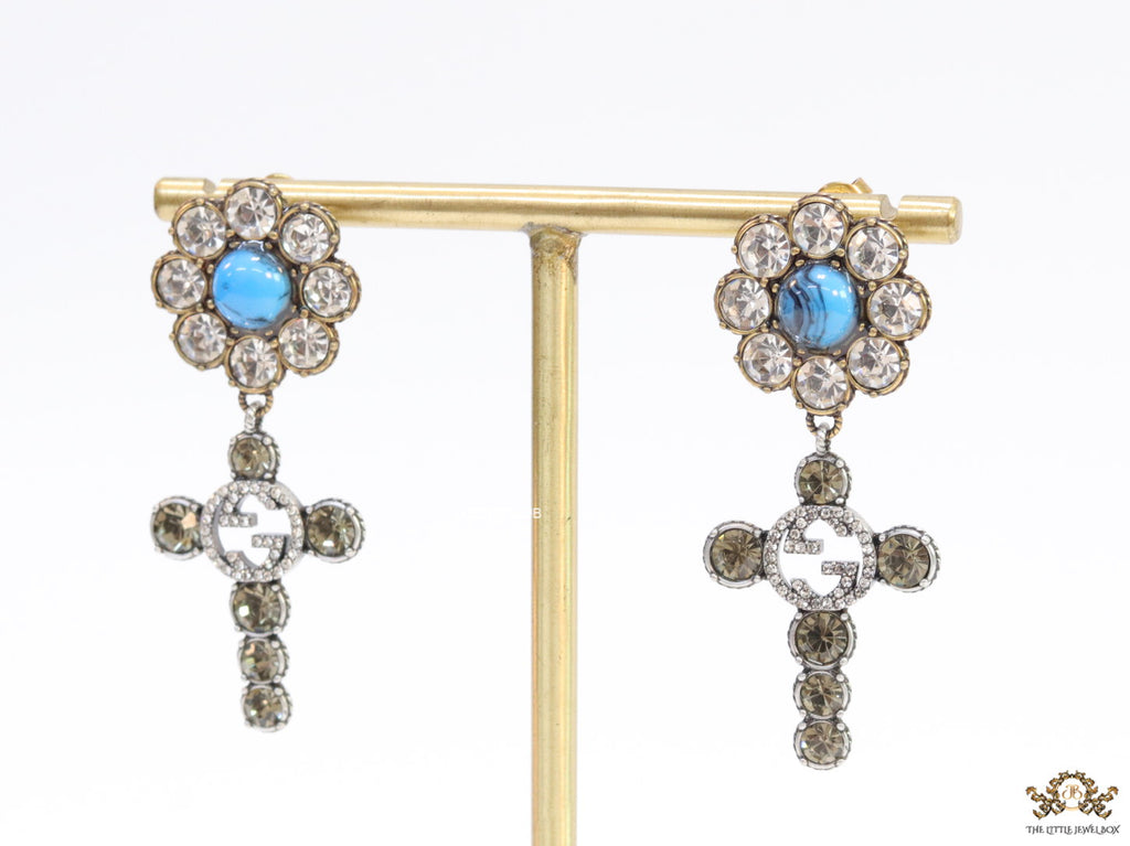 Floral cz and alphabet dangles with blue stone centre
