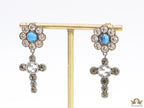 Floral cz and alphabet dangles with blue stone centre