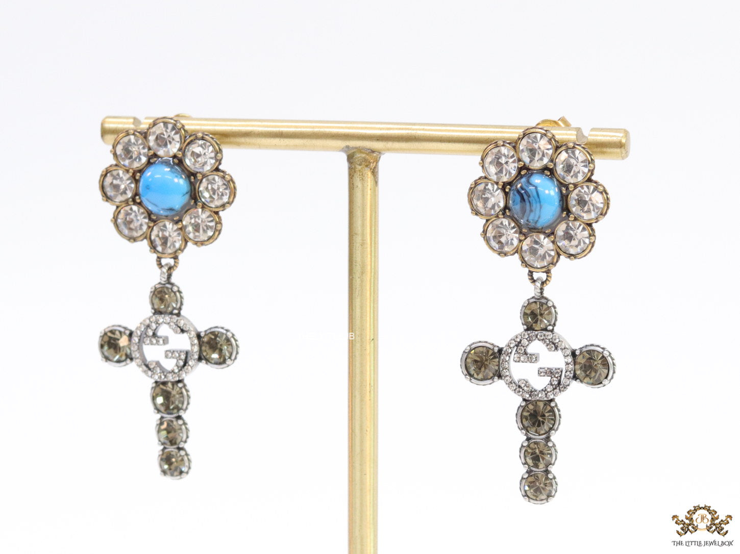 Floral cz and alphabet dangles with blue stone centre